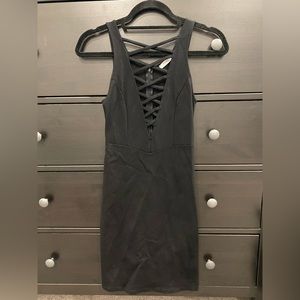Tight black dress with cut out. Size medium. Worn once.